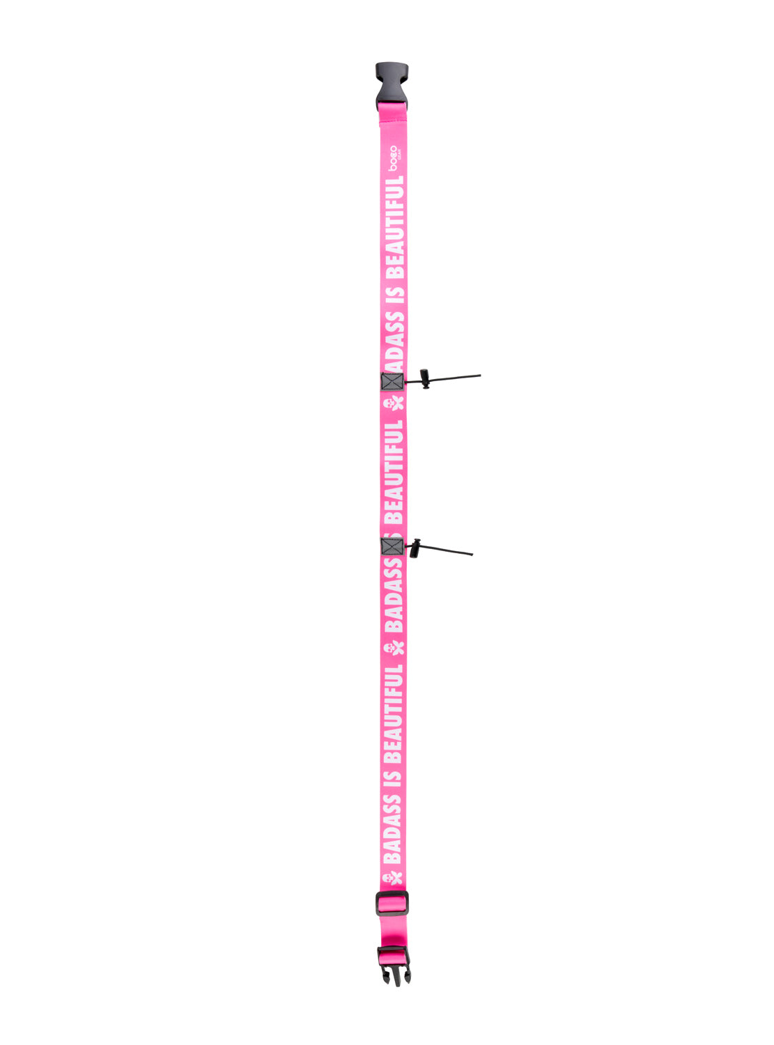 A pink adjustable strap with black plastic buckles and metal adjustment sliders, featuring the text 'BADASS IS BEAUTIFUL' printed repeatedly in white. The strap is shown vertically on a plain white background.