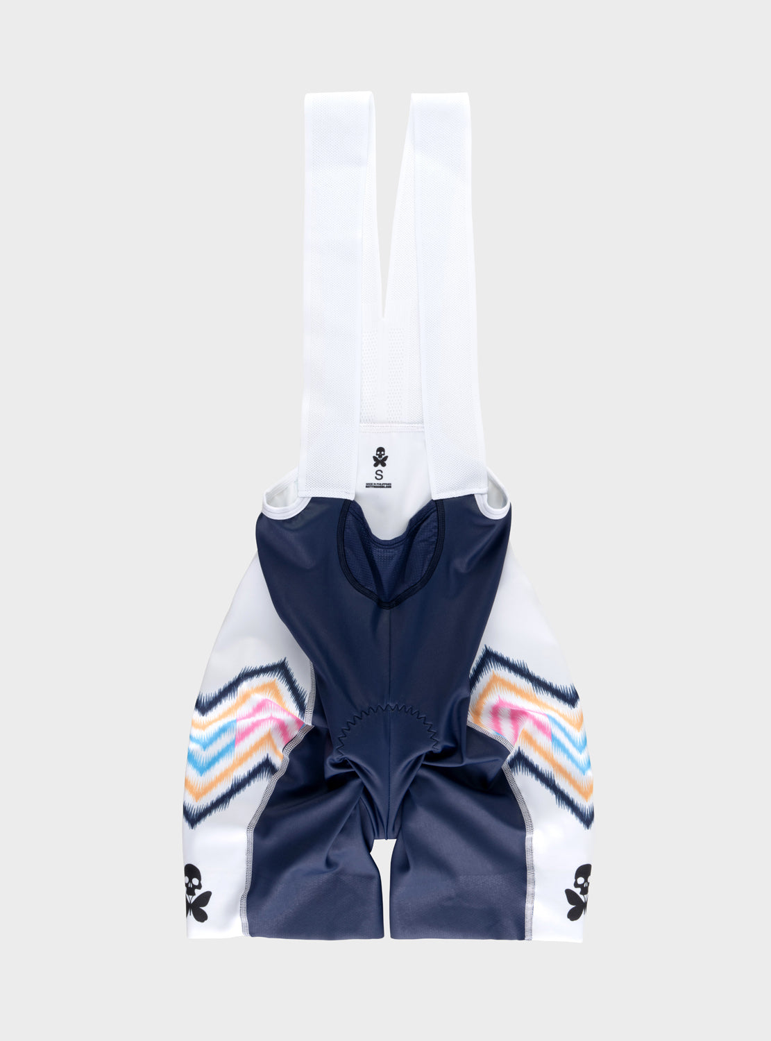 A pair of cycling bib shorts in navy blue and white, featuring multicolor striped knit details on the sides and white shoulder straps, shown against a light gray background.