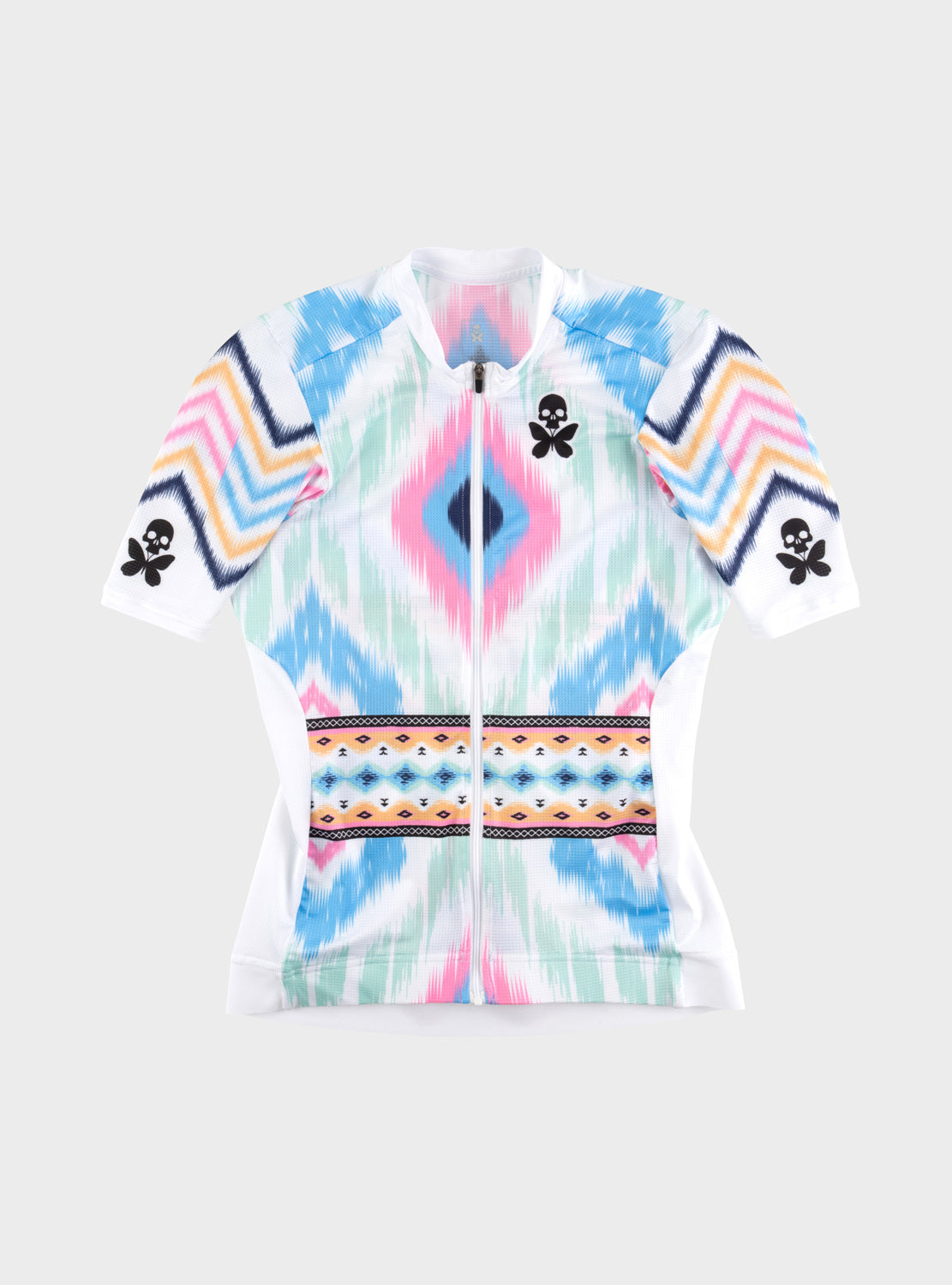 A short-sleeve cycling jersey with a colorful geometric and ikat-inspired pattern in shades of blue, pink, yellow, orange, and white, featuring black skull-and-butterfly logos on the chest and sleeves.